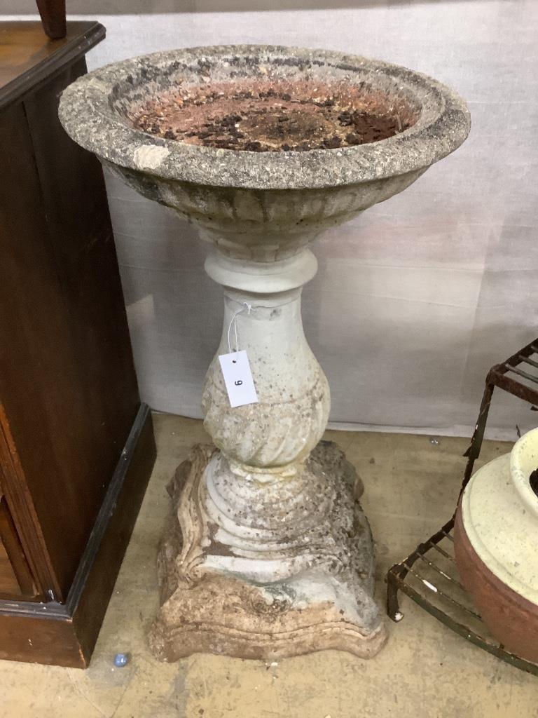 A reconstituted stone garden bird bath, diameter 42cm, height 80cm